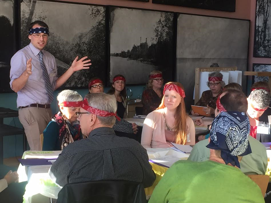 Oliver Zornow from the Building for Kids Childrens Museum in Appleton Wisconsin presents on ways to engage participants in art make through fun additions such as wearing colorful headbands.
